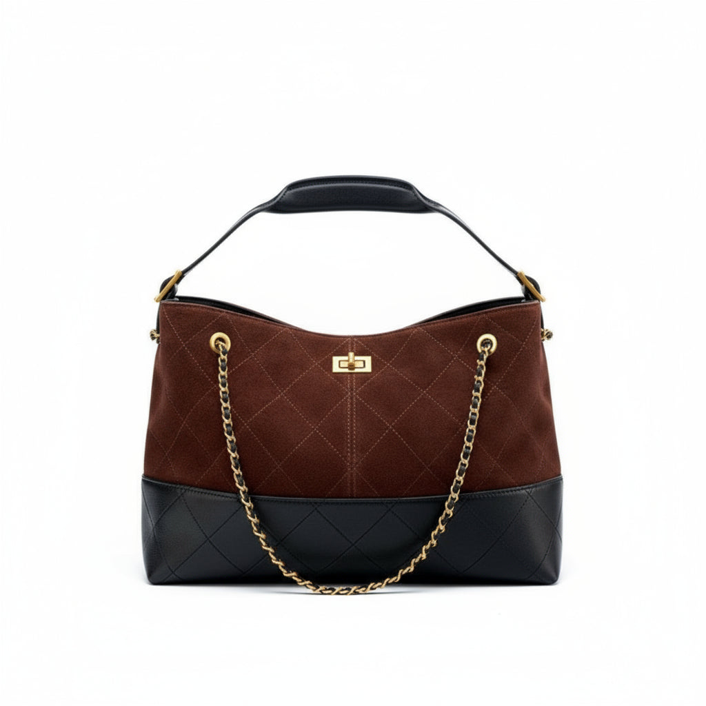 Brown and black quilted handbag with a gold chain on a white background