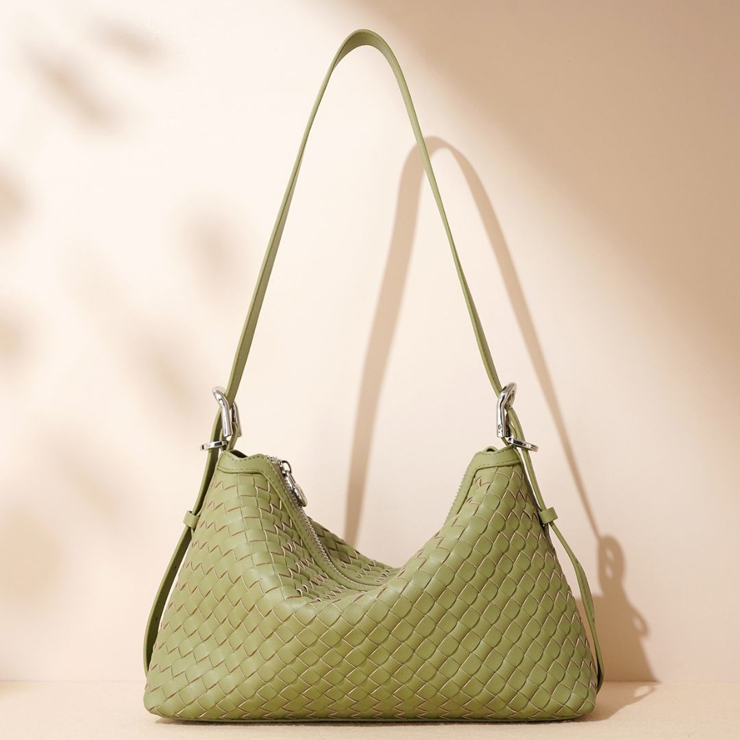 Velanci Luminous Crest Handbag: A Statement of Elegance