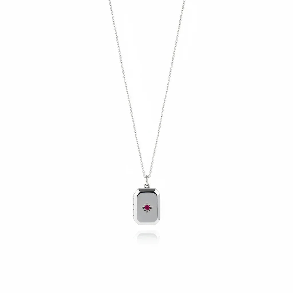 Necklace with a rectangular pendant featuring a red gemstone on a white background