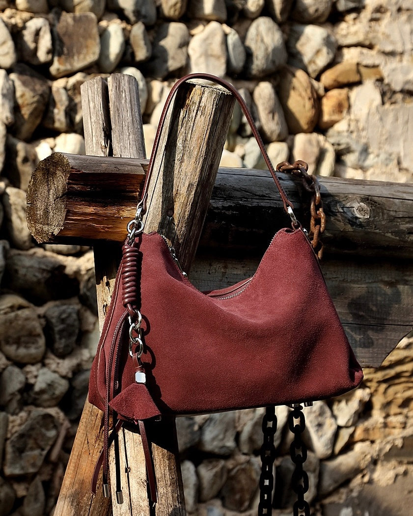 Suede Luxe Hobo Bag with Braided Elegance and Tassel Charm