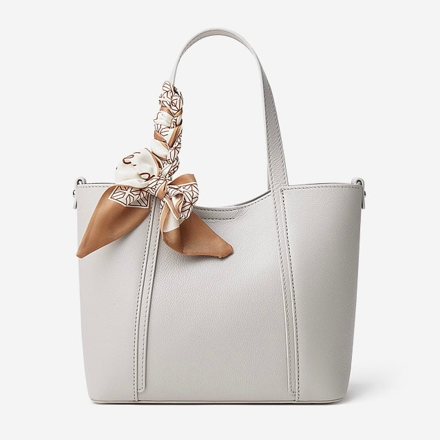 Elegant Leather Handbag with Signature Ribbon Detail