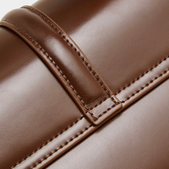 Elegant Genuine Leather Top-Handle Bag with Gilded Lock Closure