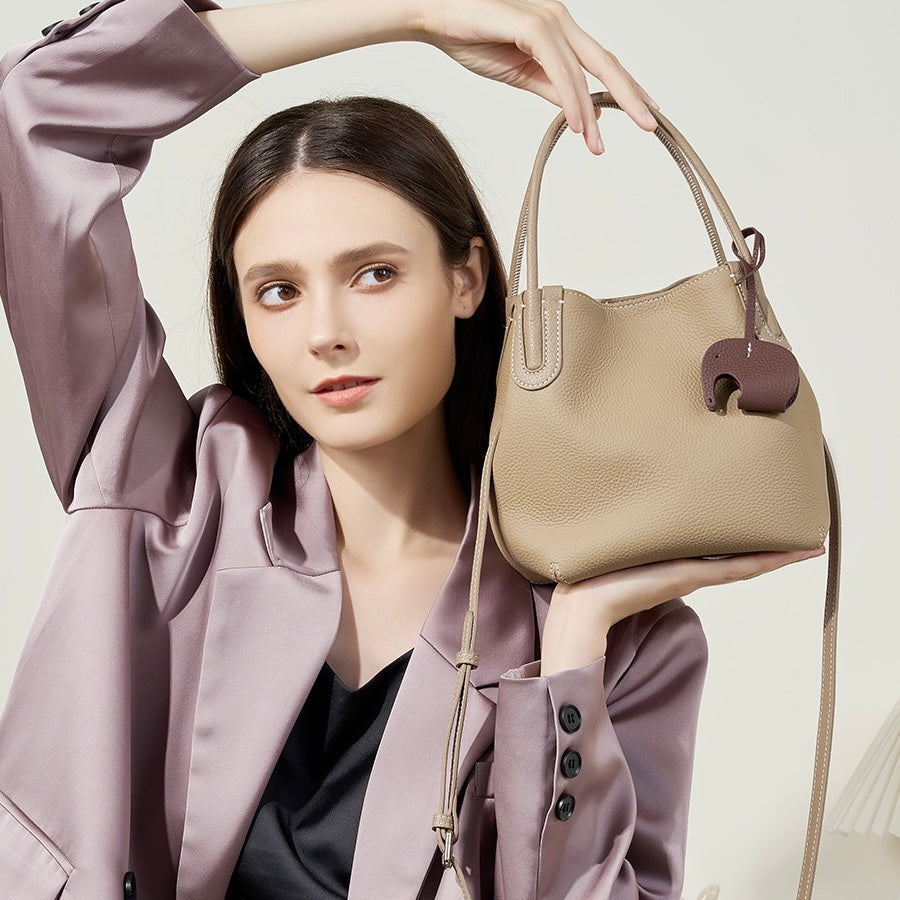 Elegant Leather Bucket Bag with Charming Elephant Pendant
