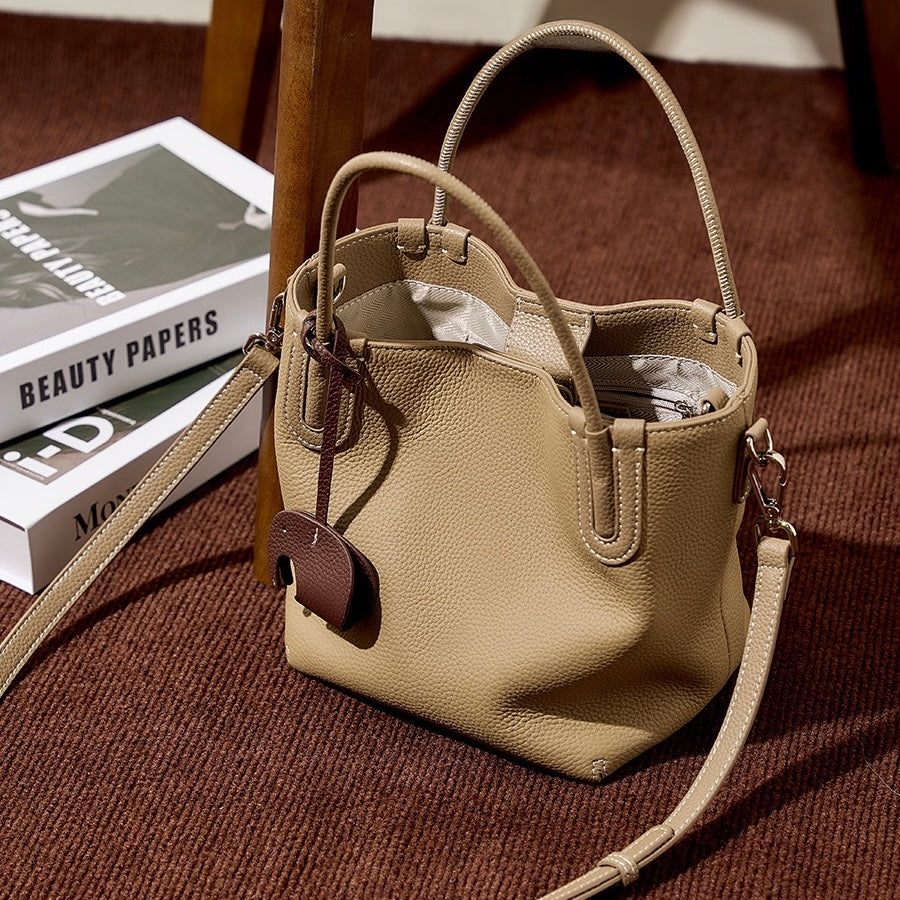 Elegant Leather Bucket Bag with Charming Elephant Pendant