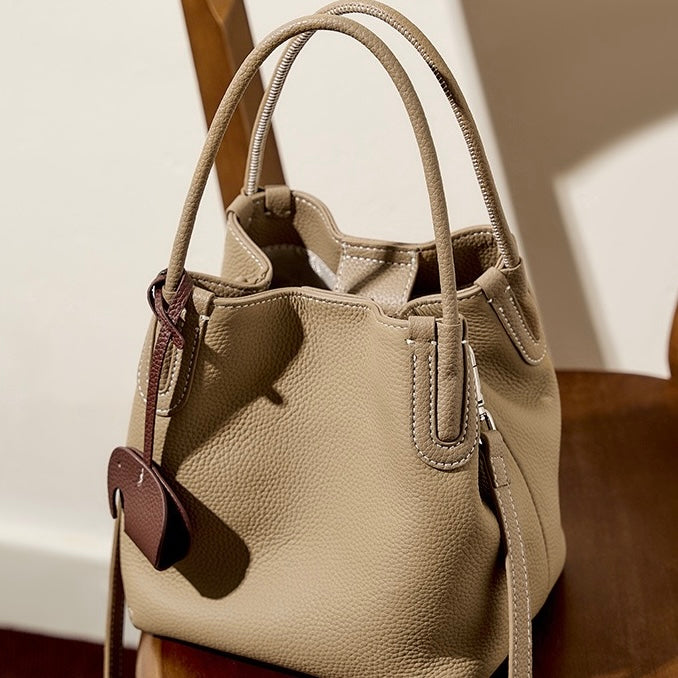 Elegant Leather Bucket Bag with Charming Elephant Pendant