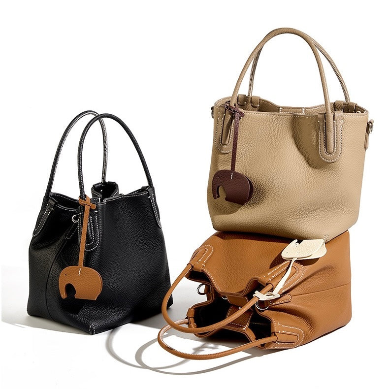 Elegant Leather Bucket Bag with Charming Elephant Pendant