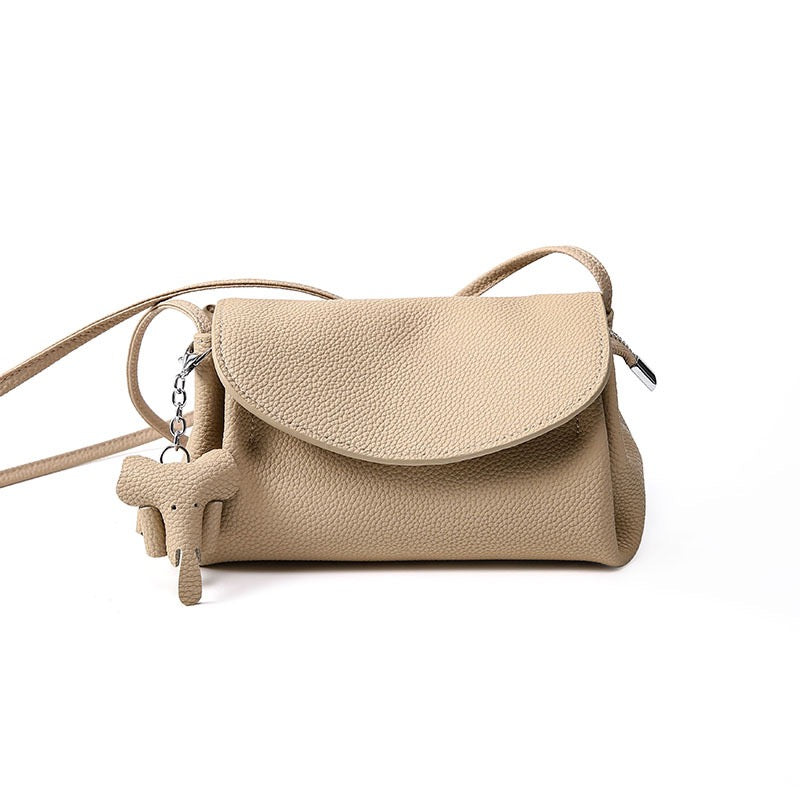 Elegant Cowhide Crossbody Bag with Mini Elephant Pendant