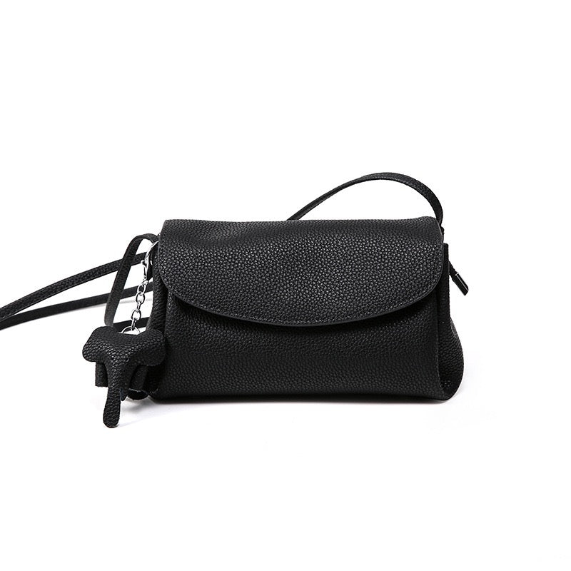 Elegant Cowhide Crossbody Bag with Mini Elephant Pendant
