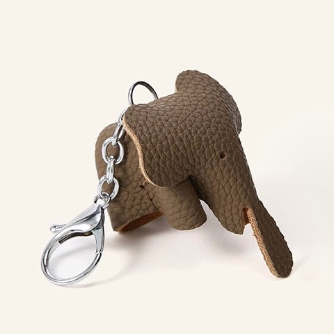 Elegant Cowhide Crossbody Bag with Mini Elephant Pendant