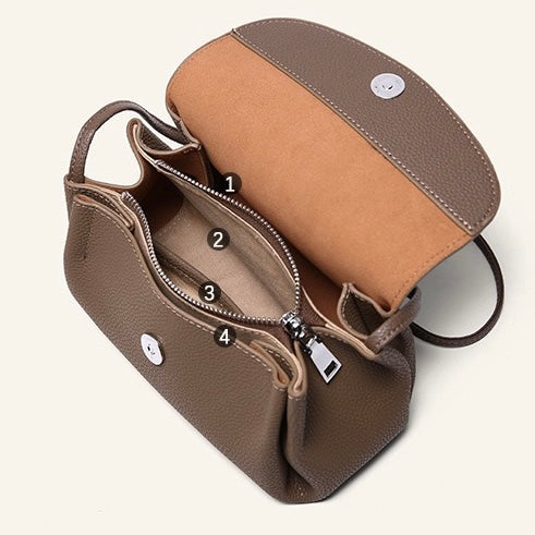 Elegant Cowhide Crossbody Bag with Mini Elephant Pendant