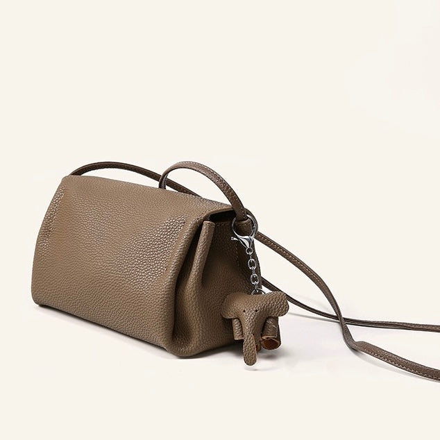 Elegant Cowhide Crossbody Bag with Mini Elephant Pendant
