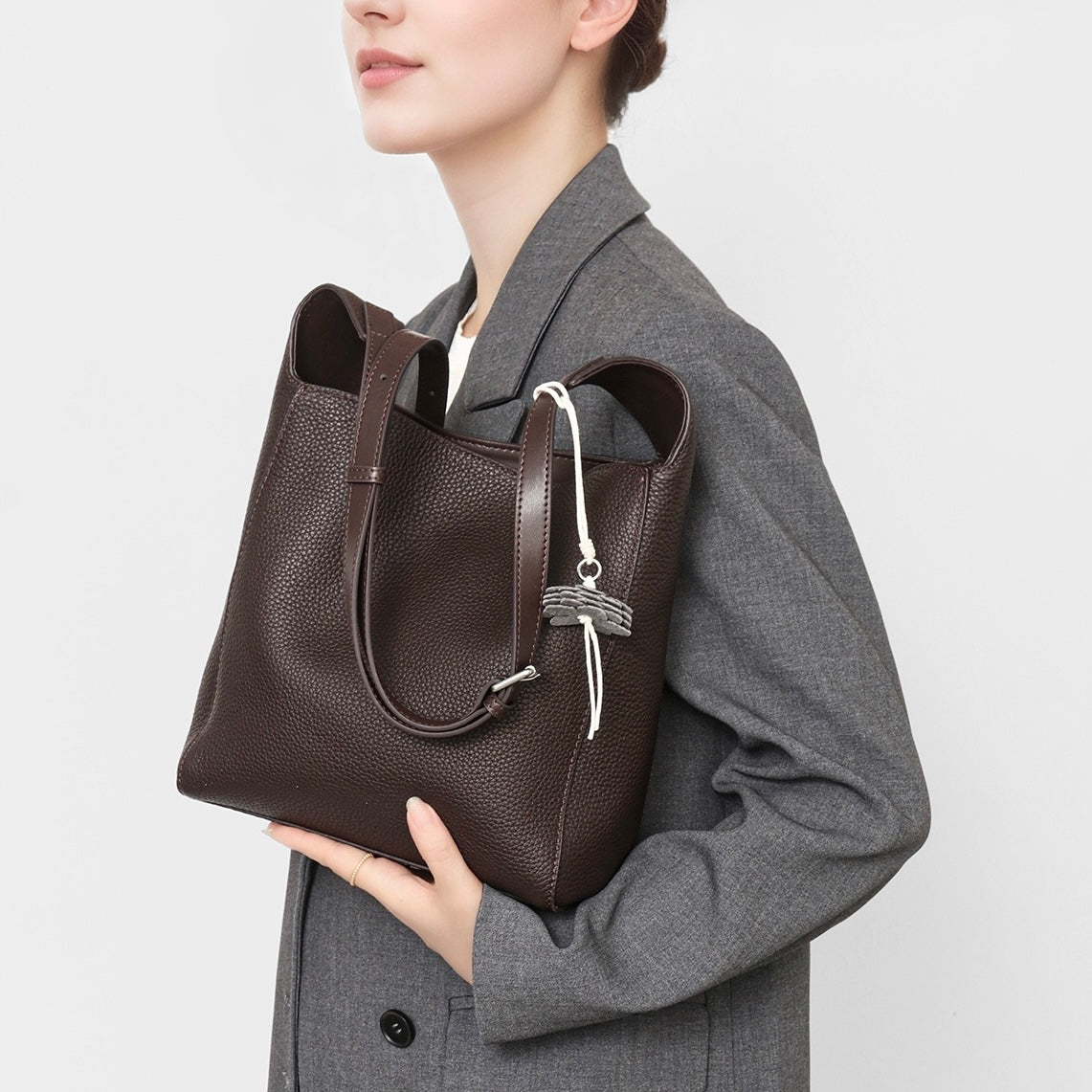 Elegant Full-Grain Leather Hobo Bag with Floral Charm