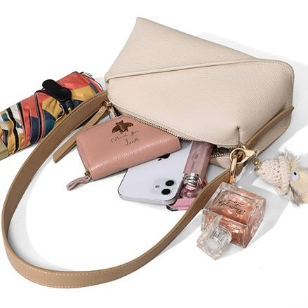 Chic Geometric Leather Crossbody Bag with Plush Charm