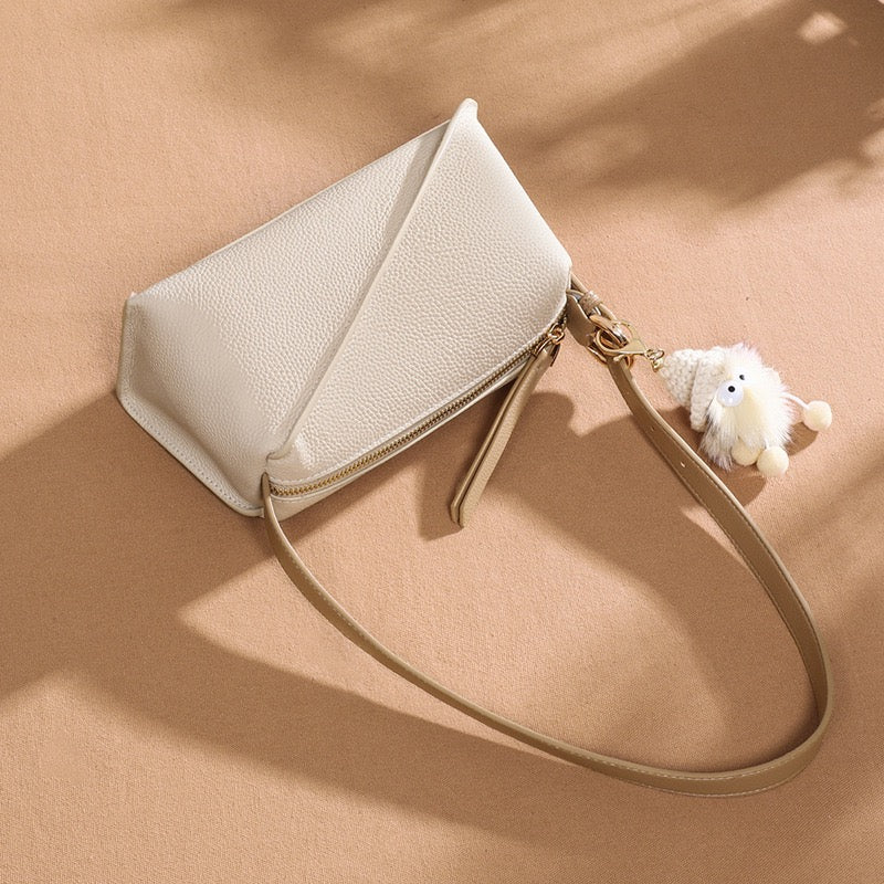Chic Geometric Leather Crossbody Bag with Plush Charm