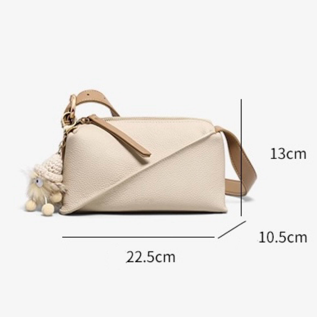 Chic Geometric Leather Crossbody Bag with Plush Charm