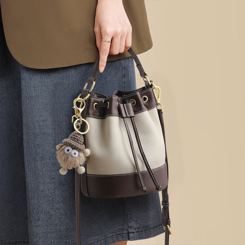 Genuine Leather Pendant Bucket Handbag – Creamy White Elegance