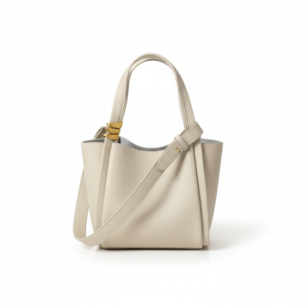 Beige handbag with a strap on a light background