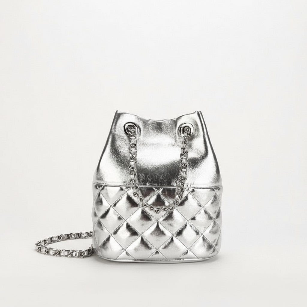 Silver quilted handbag with chain detail on a white background