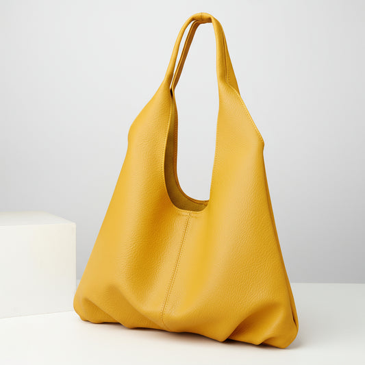 Yellow handbag on a beige background