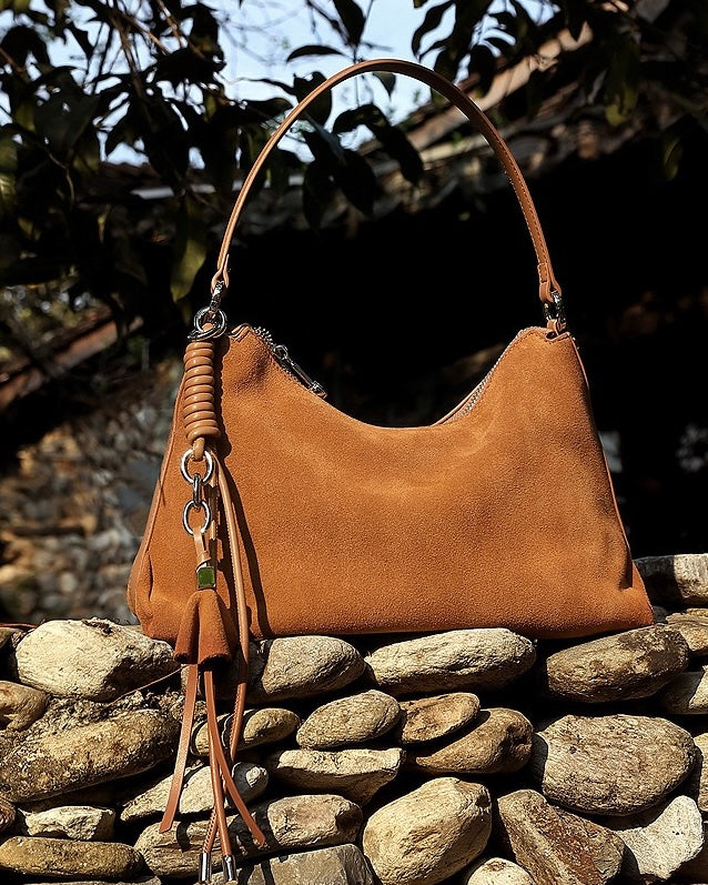 Suede Luxe Hobo Bag with Braided Elegance and Tassel Charm