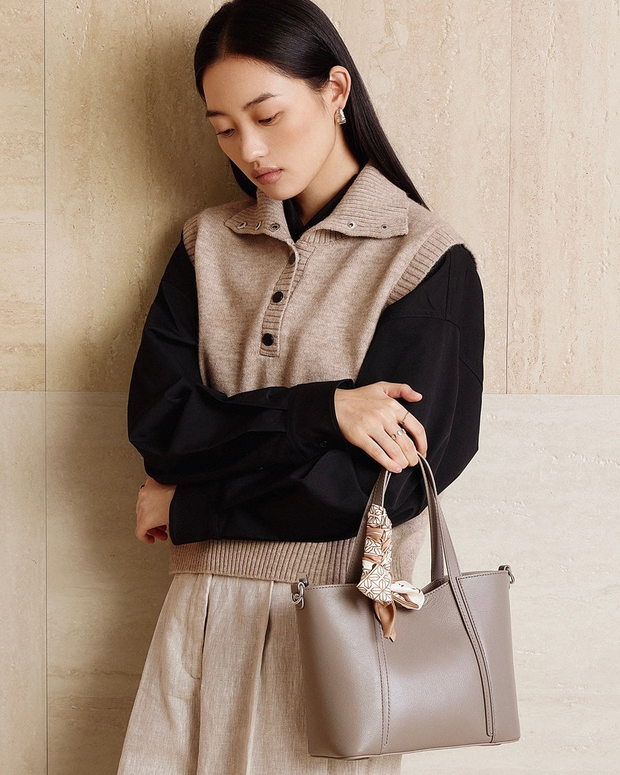 Elegant Leather Handbag with Signature Ribbon Detail