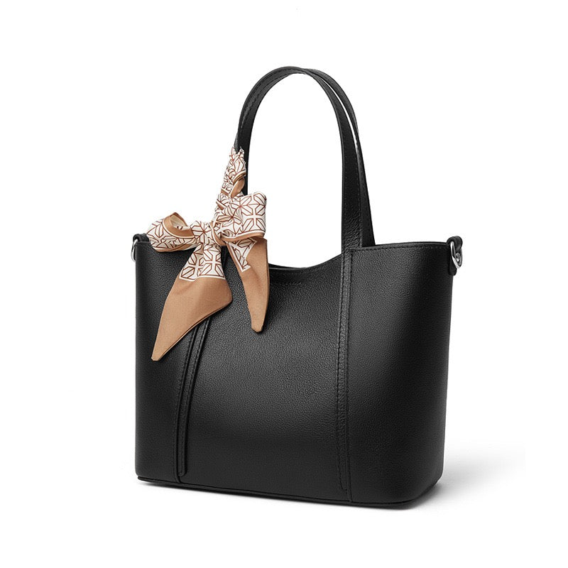 Elegant Leather Handbag with Signature Ribbon Detail