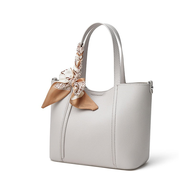 Elegant Leather Handbag with Signature Ribbon Detail