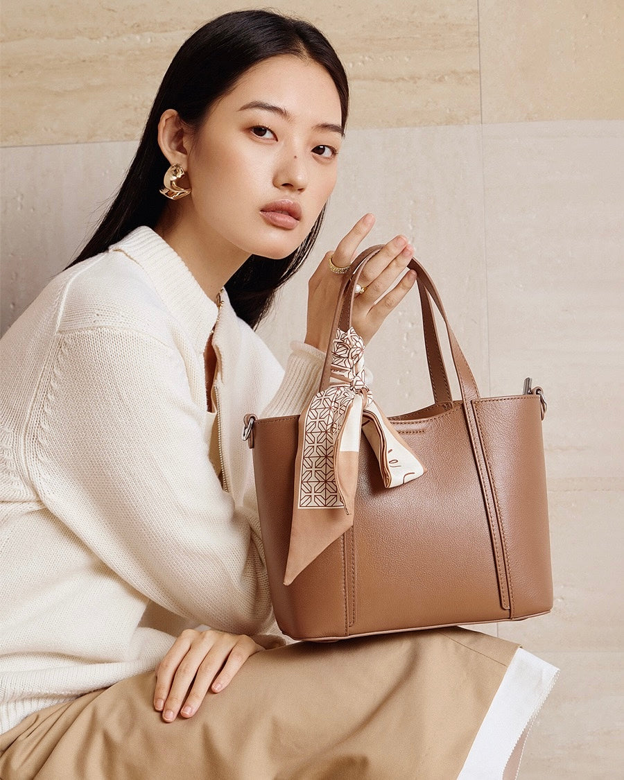 Elegant Leather Handbag with Signature Ribbon Detail