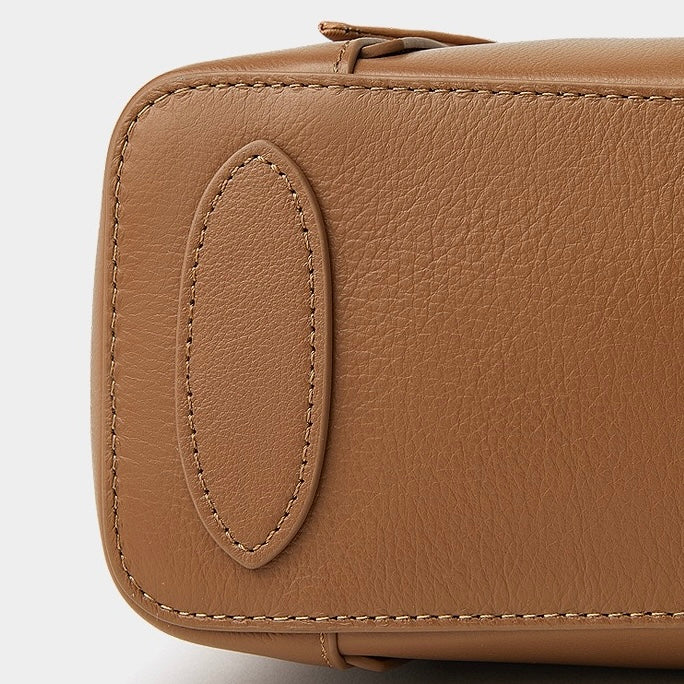 Elegant Leather Handbag with Signature Ribbon Detail