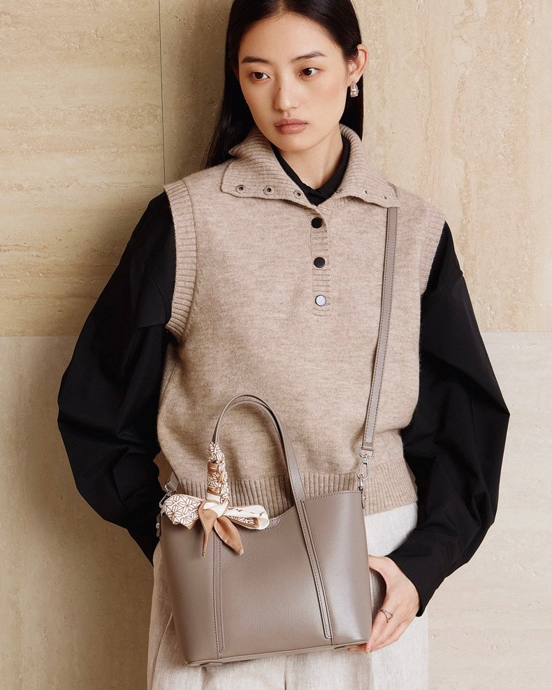 Elegant Leather Handbag with Signature Ribbon Detail