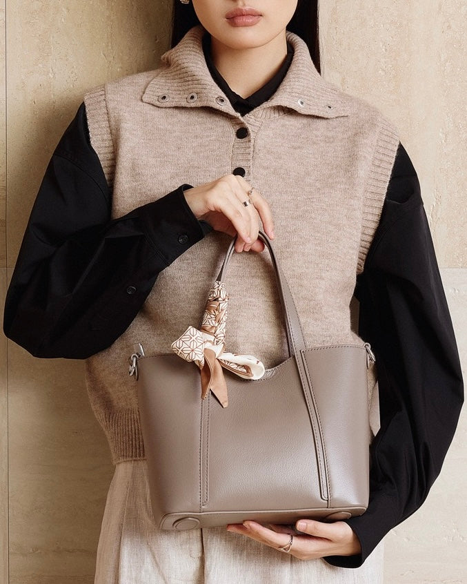 Elegant Leather Handbag with Signature Ribbon Detail