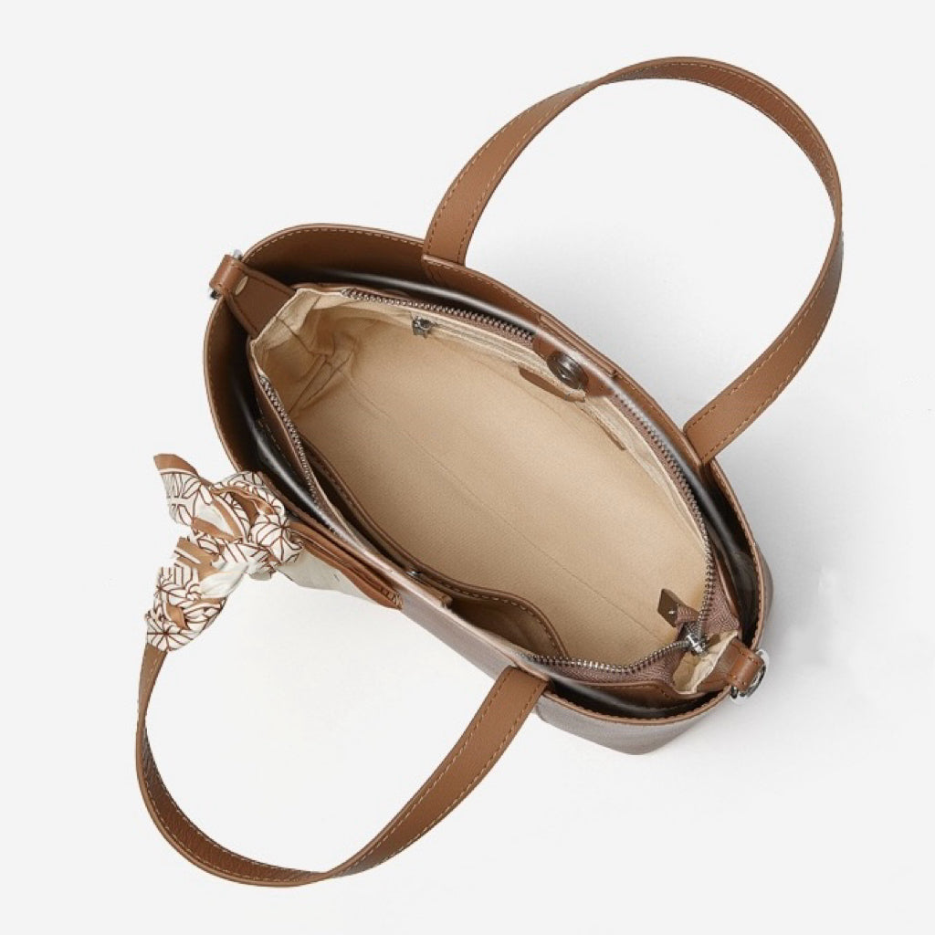 Elegant Leather Handbag with Signature Ribbon Detail