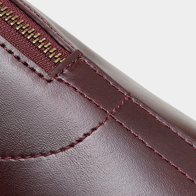 Genuine Leather Dome Satchel with Signature Tassel - Timeless Elegance