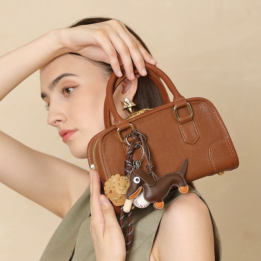 Chic Genuine Leather Boston Crossbody Bag with Whimsical Dachshund Pendant