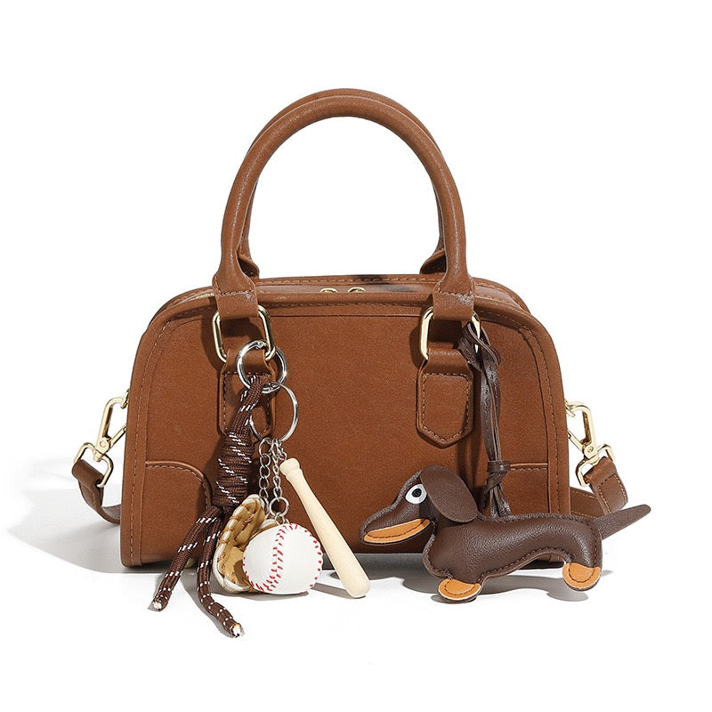Chic Genuine Leather Boston Crossbody Bag with Whimsical Dachshund Pendant