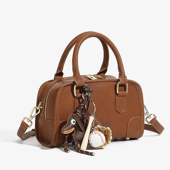 Chic Genuine Leather Boston Crossbody Bag with Whimsical Dachshund Pendant