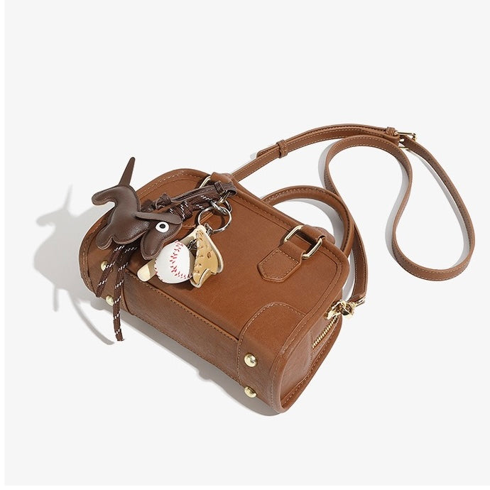 Chic Genuine Leather Boston Crossbody Bag with Whimsical Dachshund Pendant