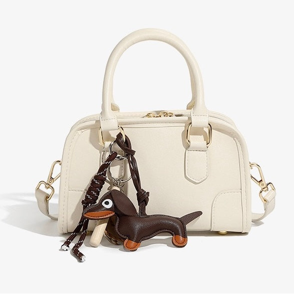 Chic Genuine Leather Boston Crossbody Bag with Whimsical Dachshund Pendant
