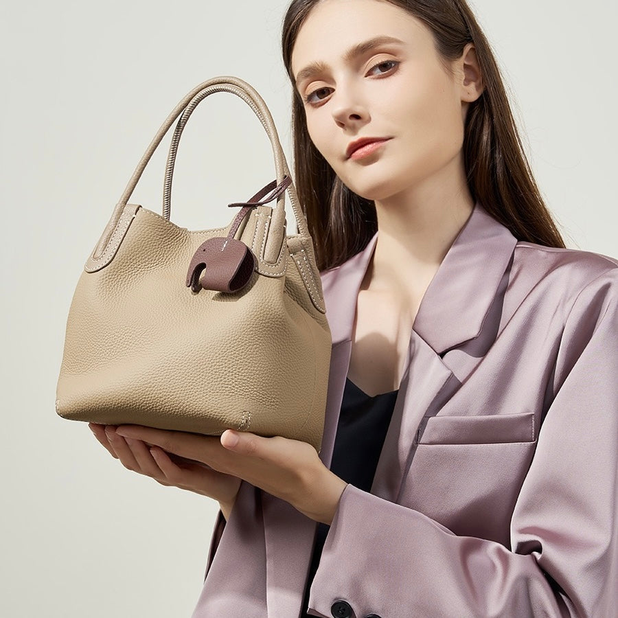 Elegant Leather Bucket Bag with Charming Elephant Pendant