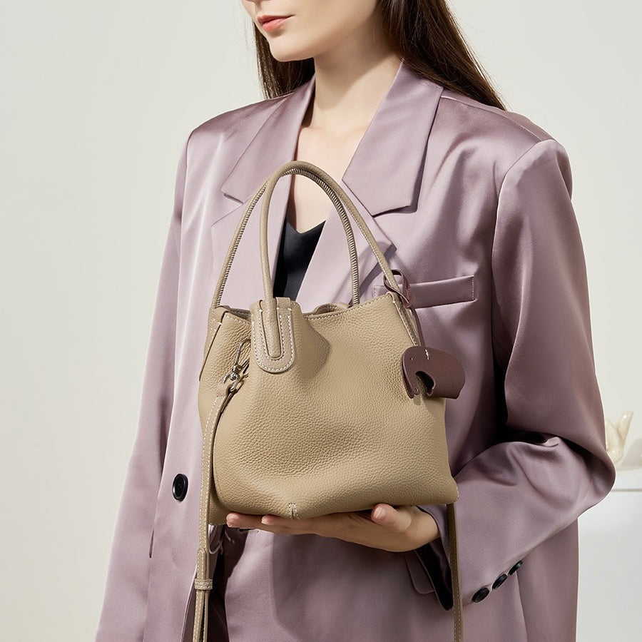 Elegant Leather Bucket Bag with Charming Elephant Pendant