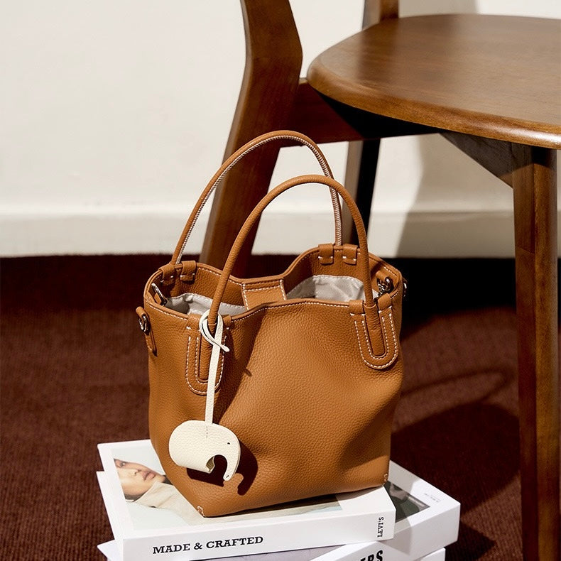 Elegant Leather Bucket Bag with Charming Elephant Pendant