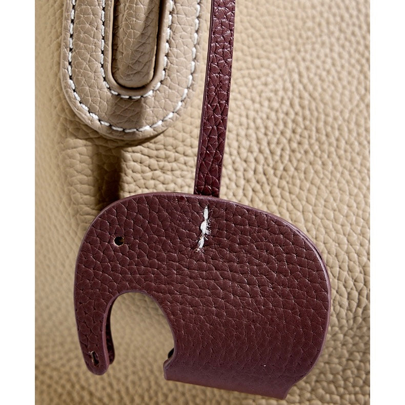 Elegant Leather Bucket Bag with Charming Elephant Pendant