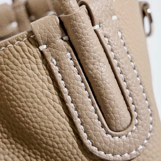 Elegant Leather Bucket Bag with Charming Elephant Pendant