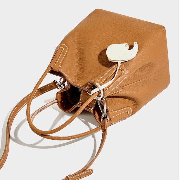 Elegant Leather Bucket Bag with Charming Elephant Pendant