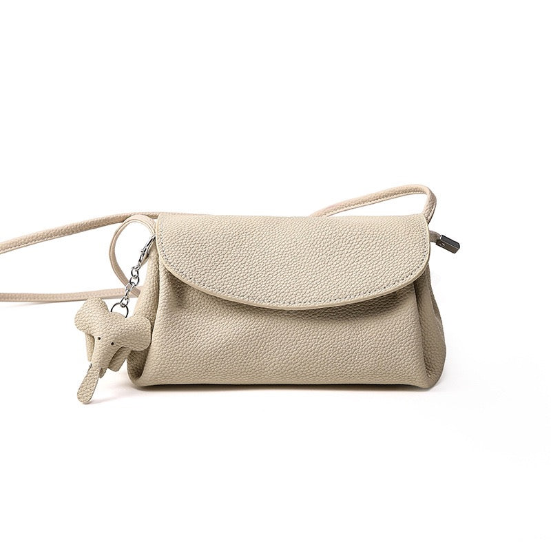 Elegant Cowhide Crossbody Bag with Mini Elephant Pendant