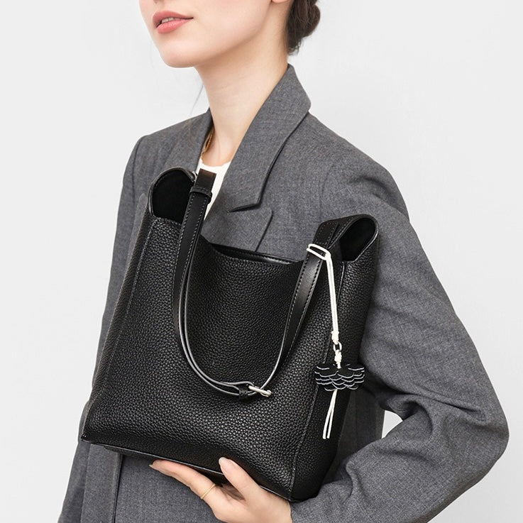 Elegant Full-Grain Leather Hobo Bag with Floral Charm