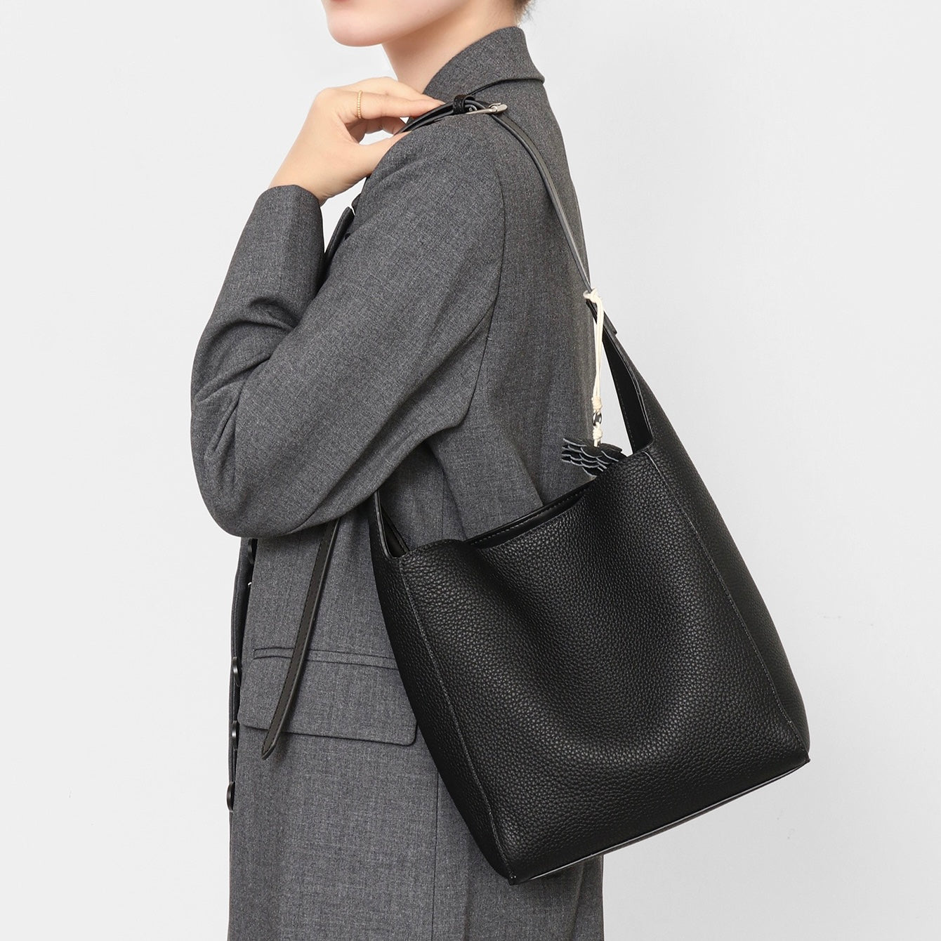 Elegant Full-Grain Leather Hobo Bag with Floral Charm