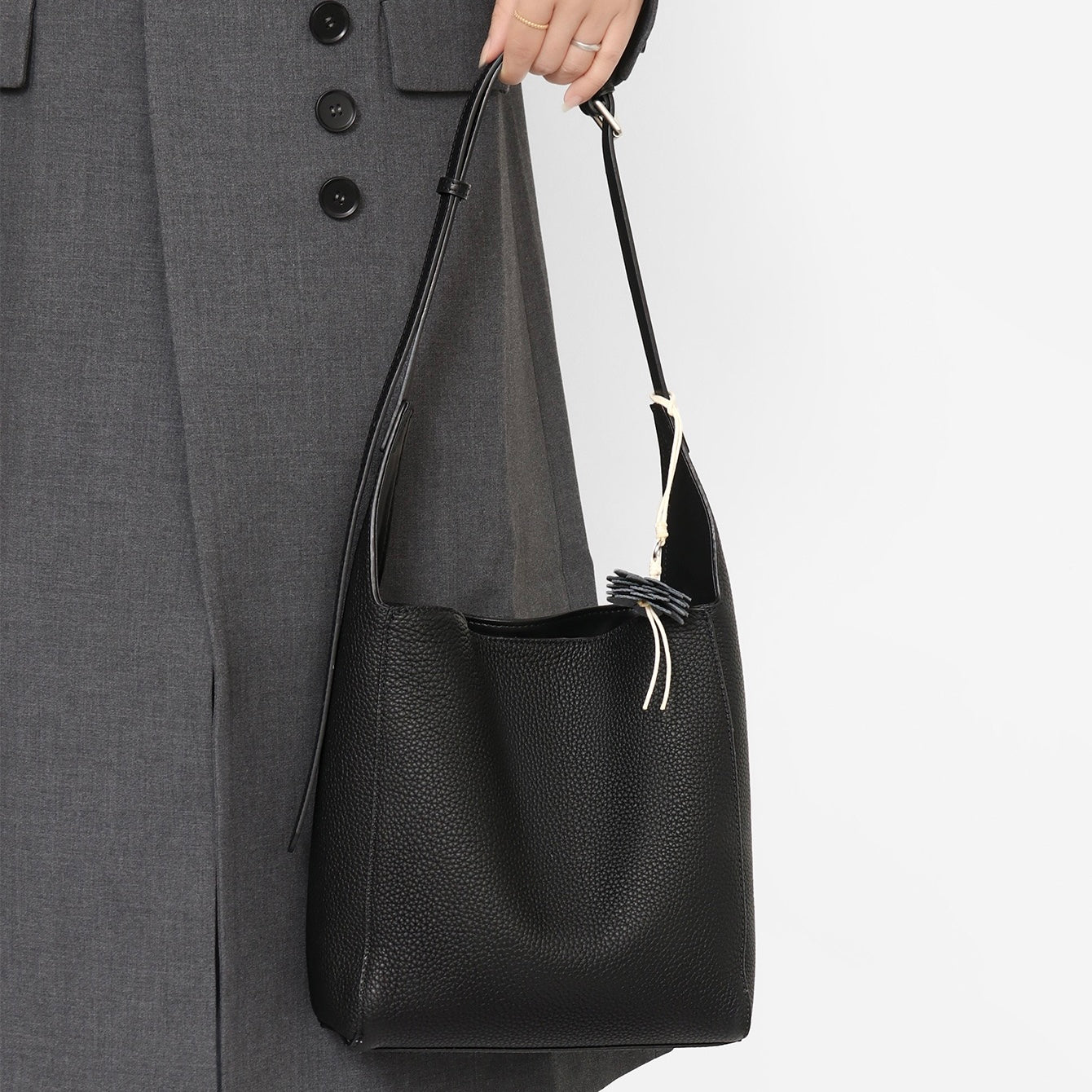 Elegant Full-Grain Leather Hobo Bag with Floral Charm