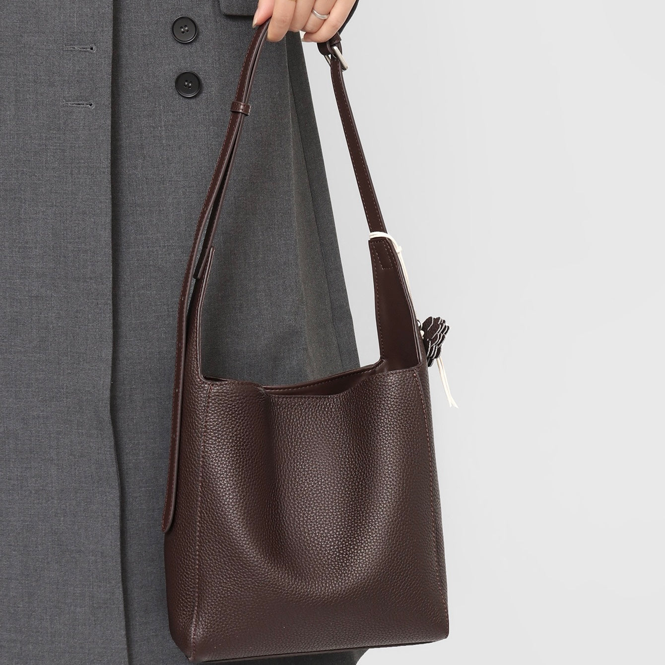 Elegant Full-Grain Leather Hobo Bag with Floral Charm