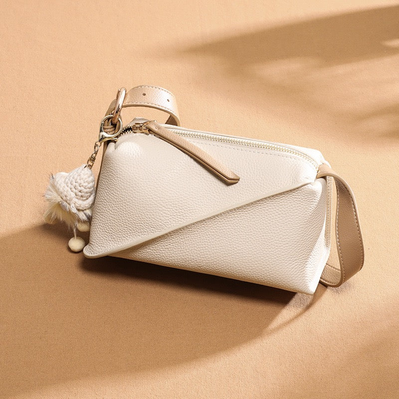 Chic Geometric Leather Crossbody Bag with Plush Charm